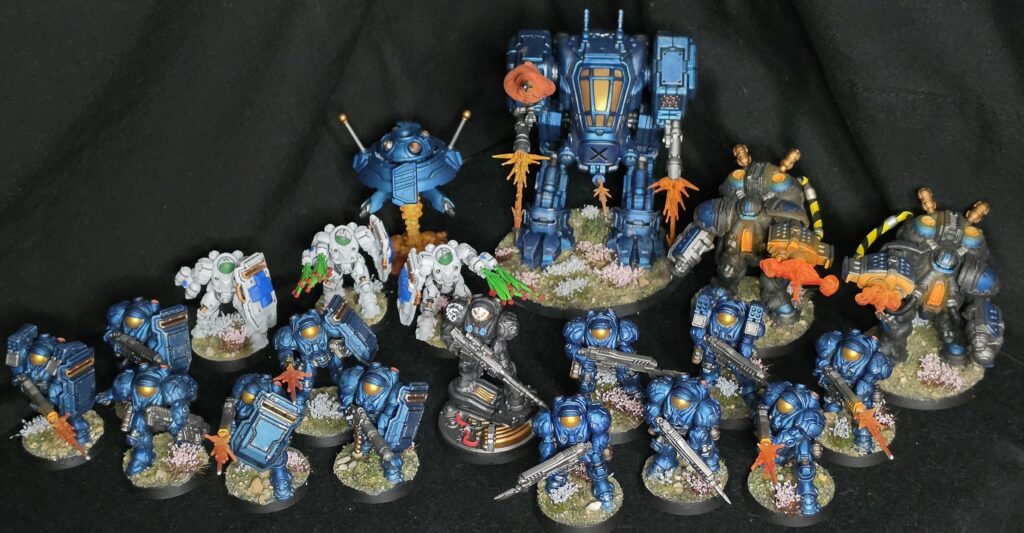 StarCraft TMG - Bemalte Terran-Armee mit Goliath, Marines, Marauders und Medics, Foto von u/Enjoy_Bacon (Quelle: https://www.reddit.com/r/StarCraftTMG/comments/1x6b8eo/family_photo/)